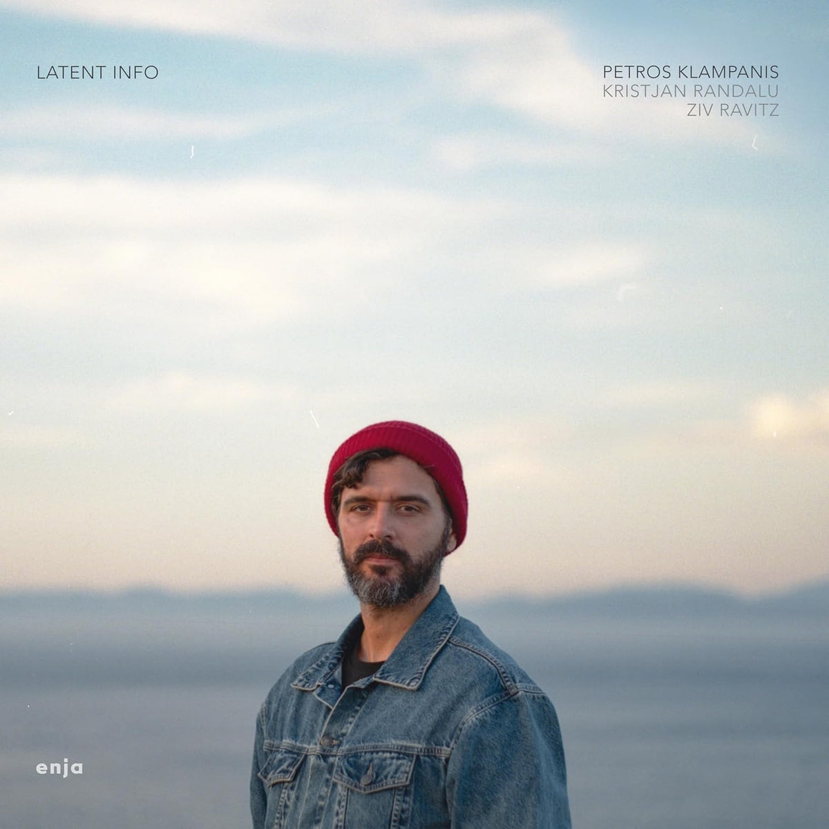 Album cover for Petros Klampanis’ “Latent Info” featuring a man in a red hat.