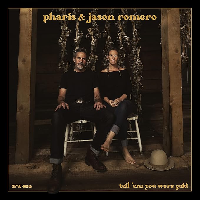 CD cover featuring a man and woman seated before drying herbs.