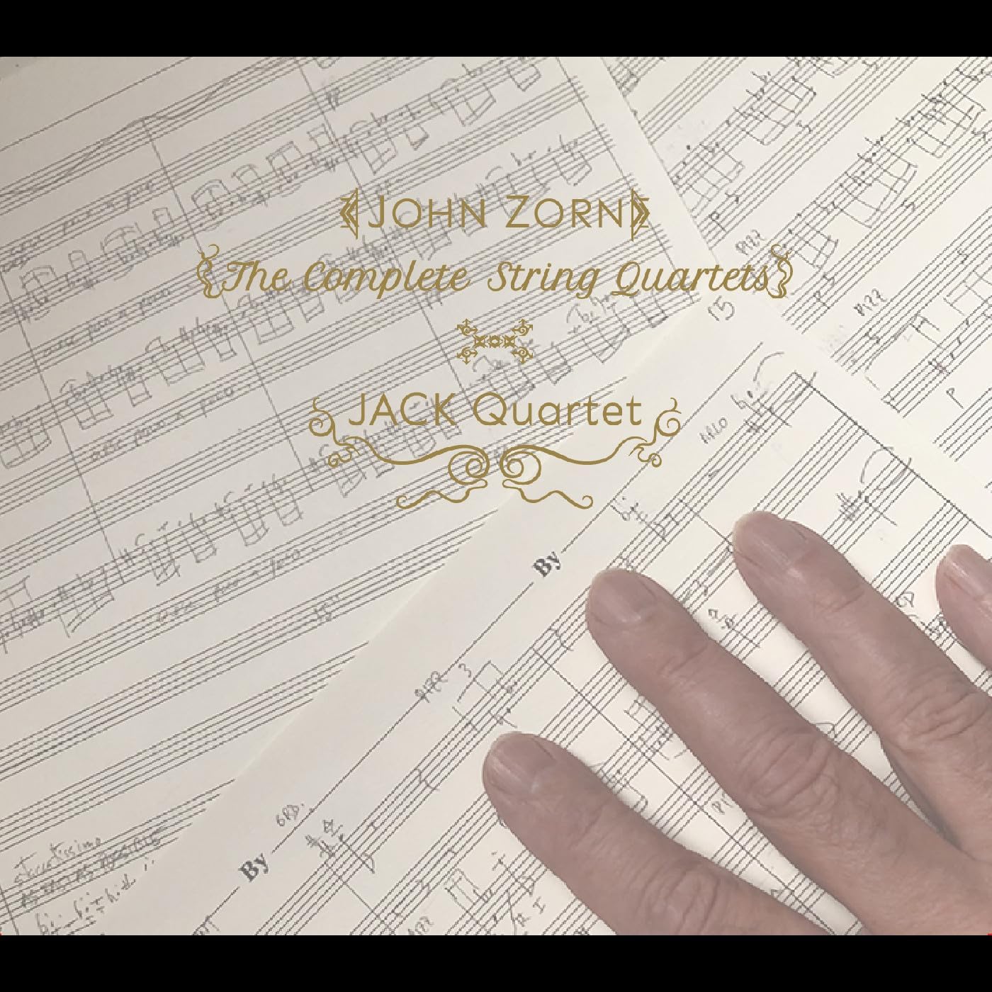 Sheet music with text “John Zorn, The Complete String Quartets.”