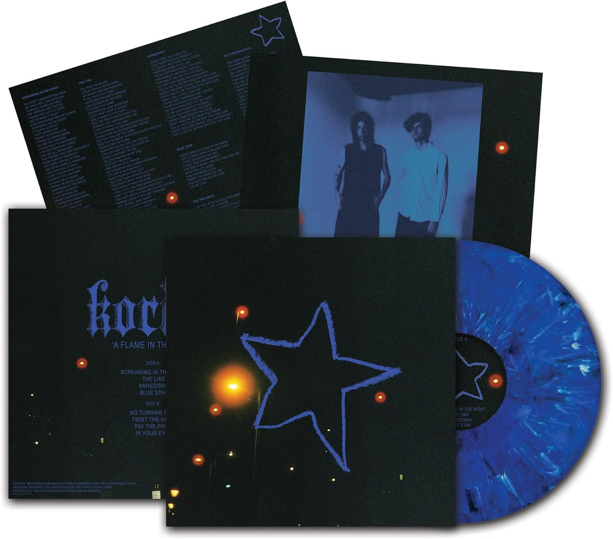 Vinyl record with aqua blue and cyan swirl, featuring album artwork and lyrics.