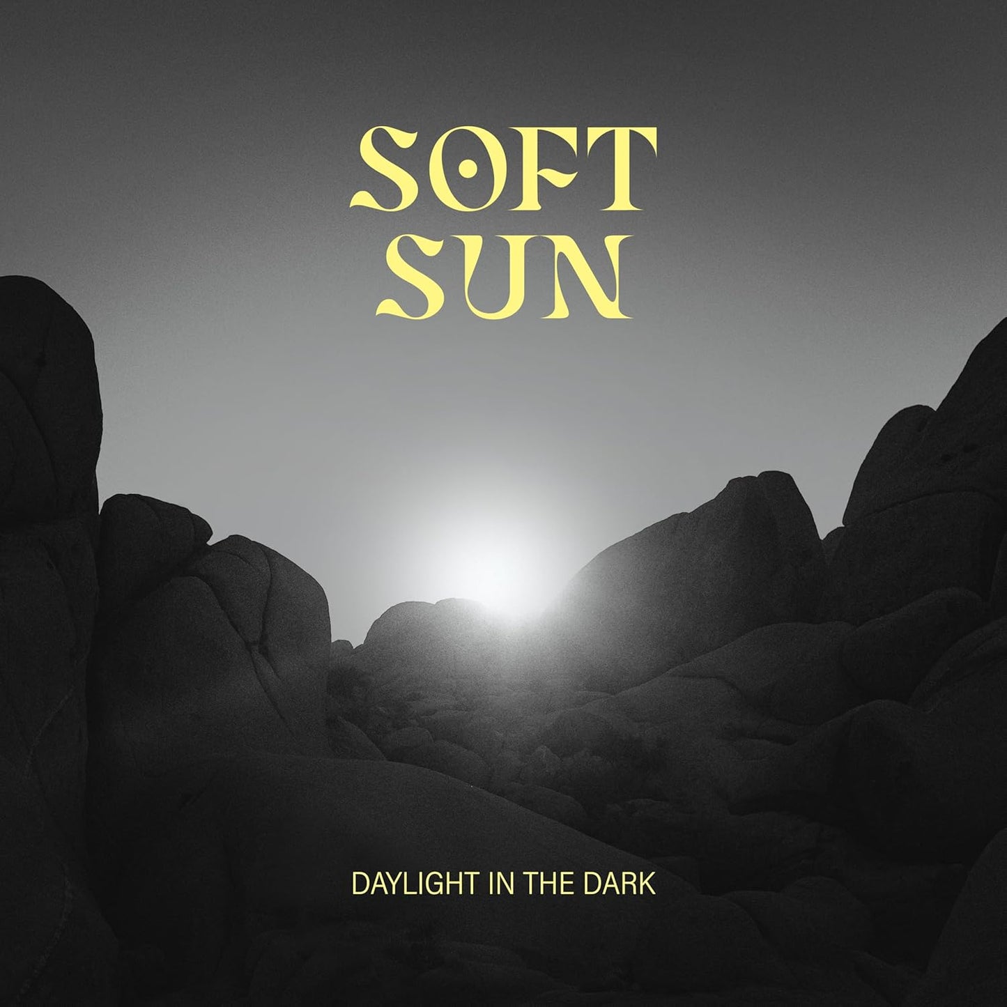 Album cover: dark landscape with a bright sun and text "Soft Sun".