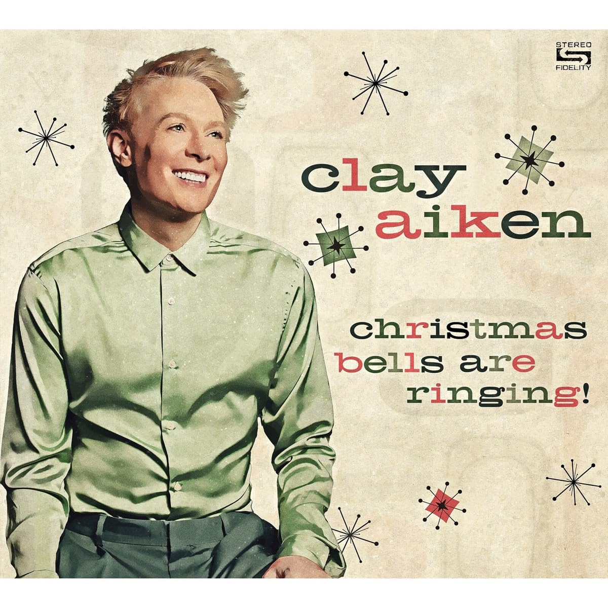 Clay Aiken album cover, "Christmas Bells Are Ringing," with starbursts.