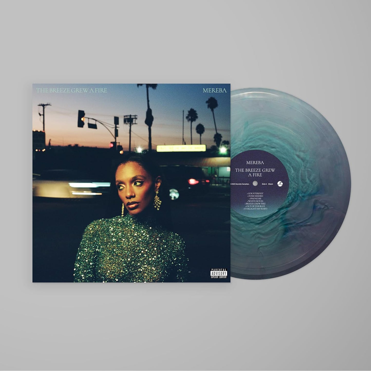 Vinyl record of Mereba’s “The Breeze Grew A Fire” with portrait and landscape.