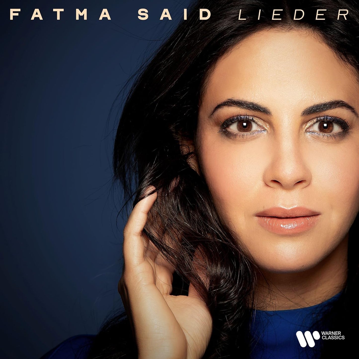 Close-up portrait of Fatma Said, a woman with dark hair and brown eyes.