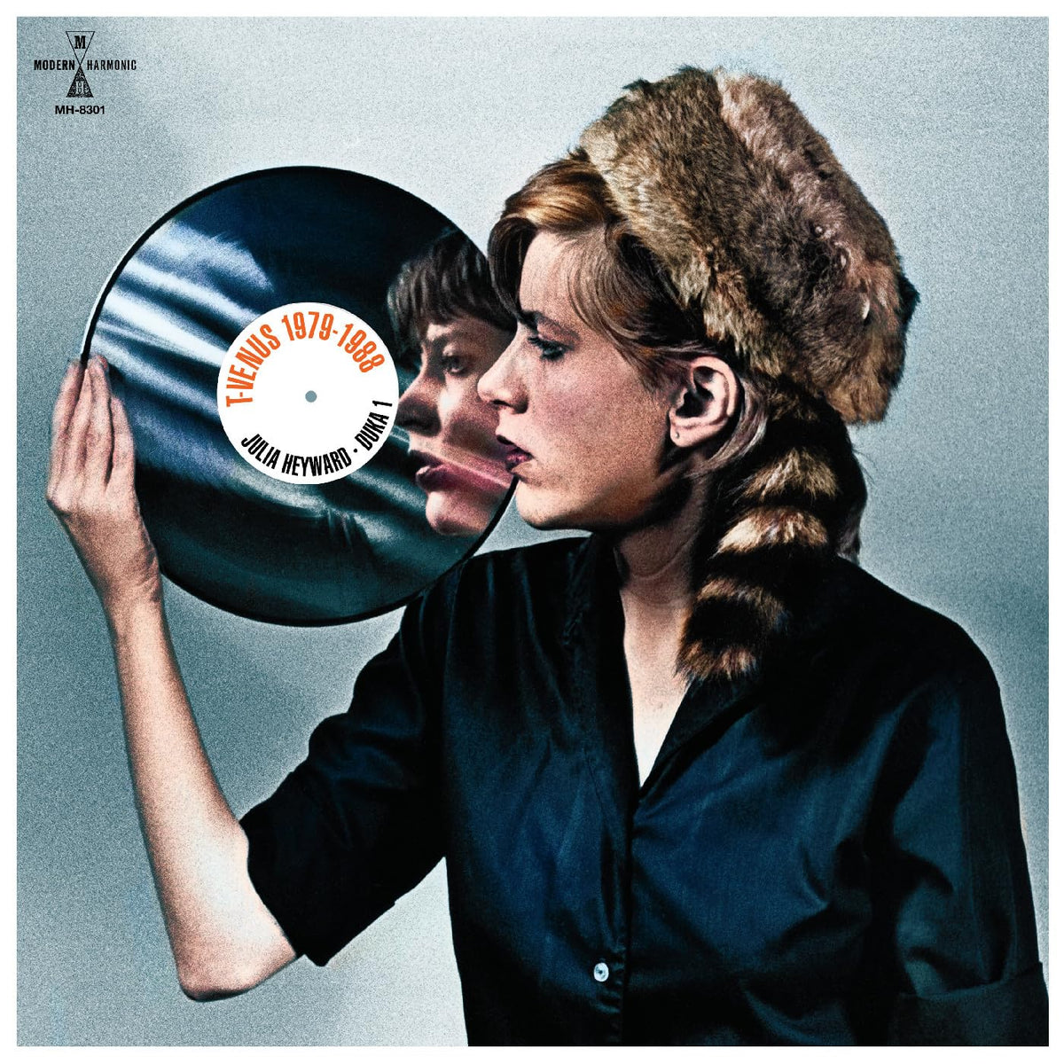 Vinyl record cover featuring a woman with short hair and a fur collar.