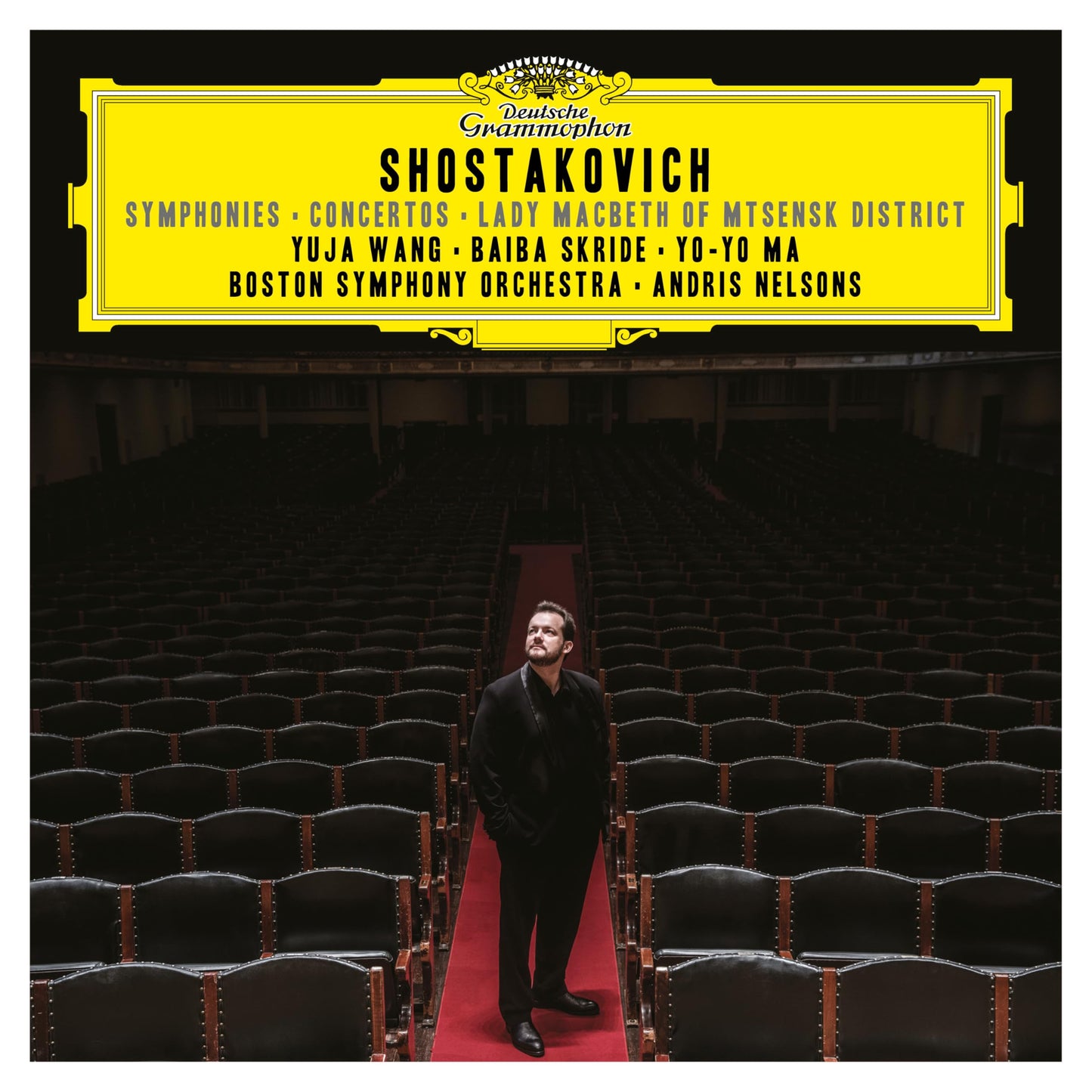 Andris Nelsons standing in an empty concert hall on a Deutsche Grammophon album cover.
