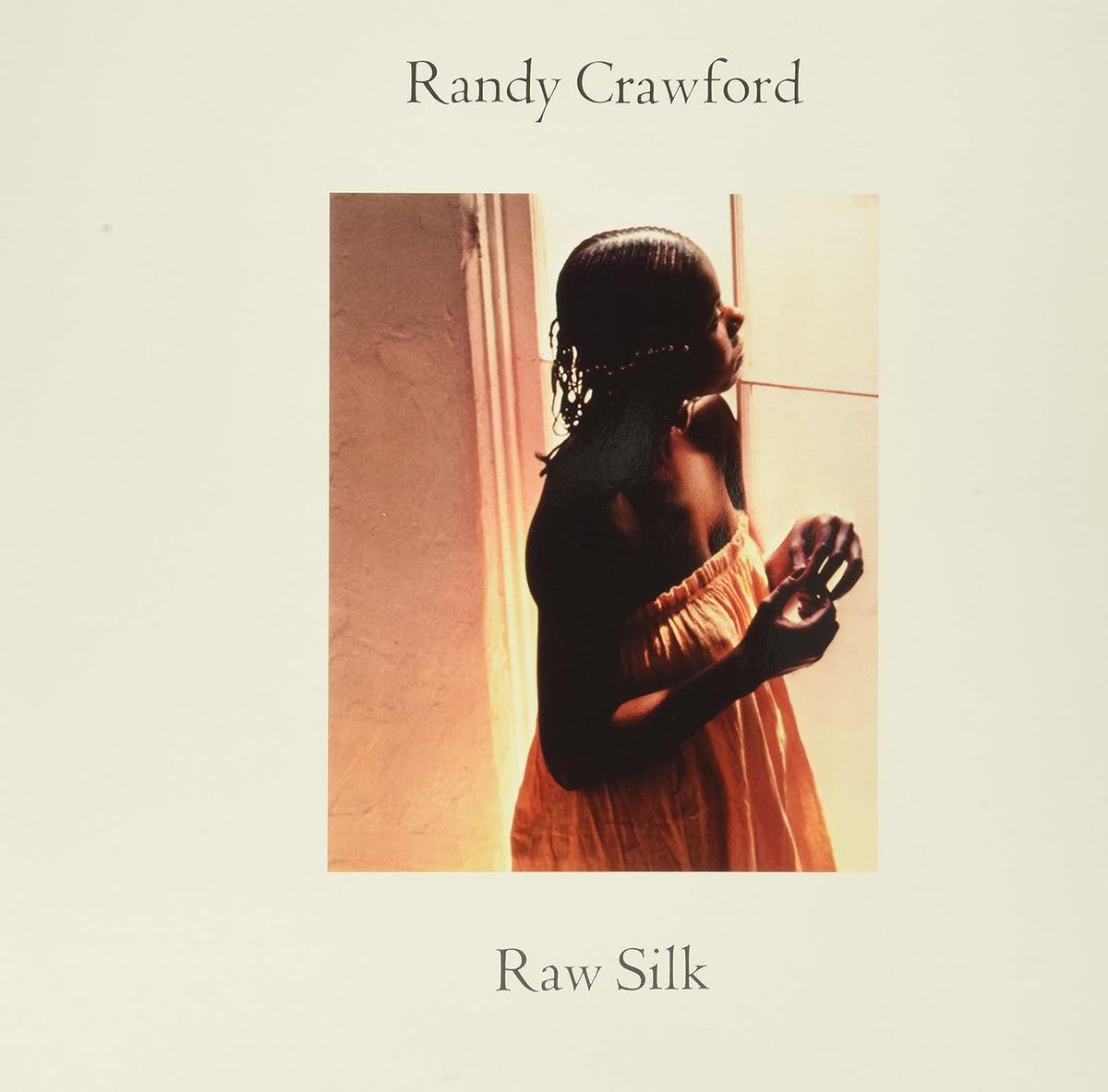Randy Crawford’s “Raw Silk” vinyl album cover featuring a woman in orange.