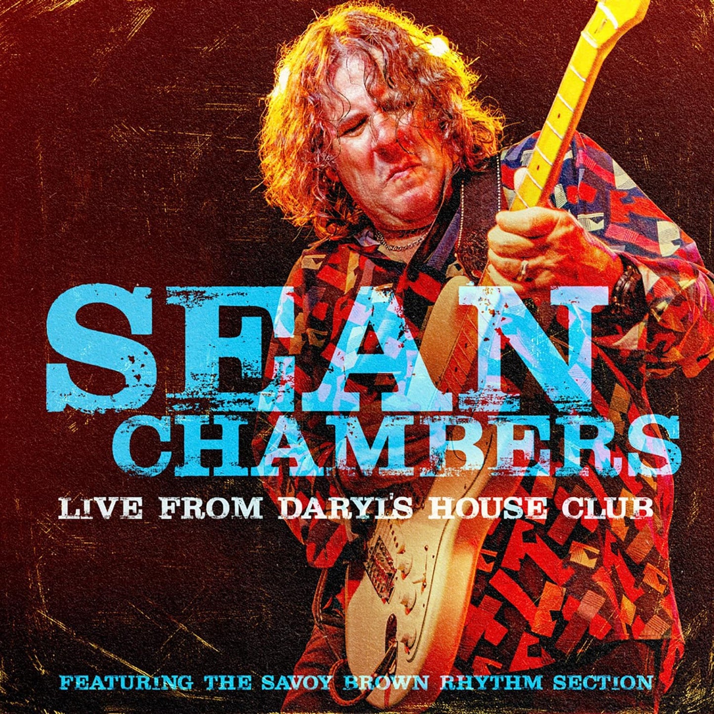 Sean Chambers playing electric guitar on the album cover for Live From Daryl's House Club.