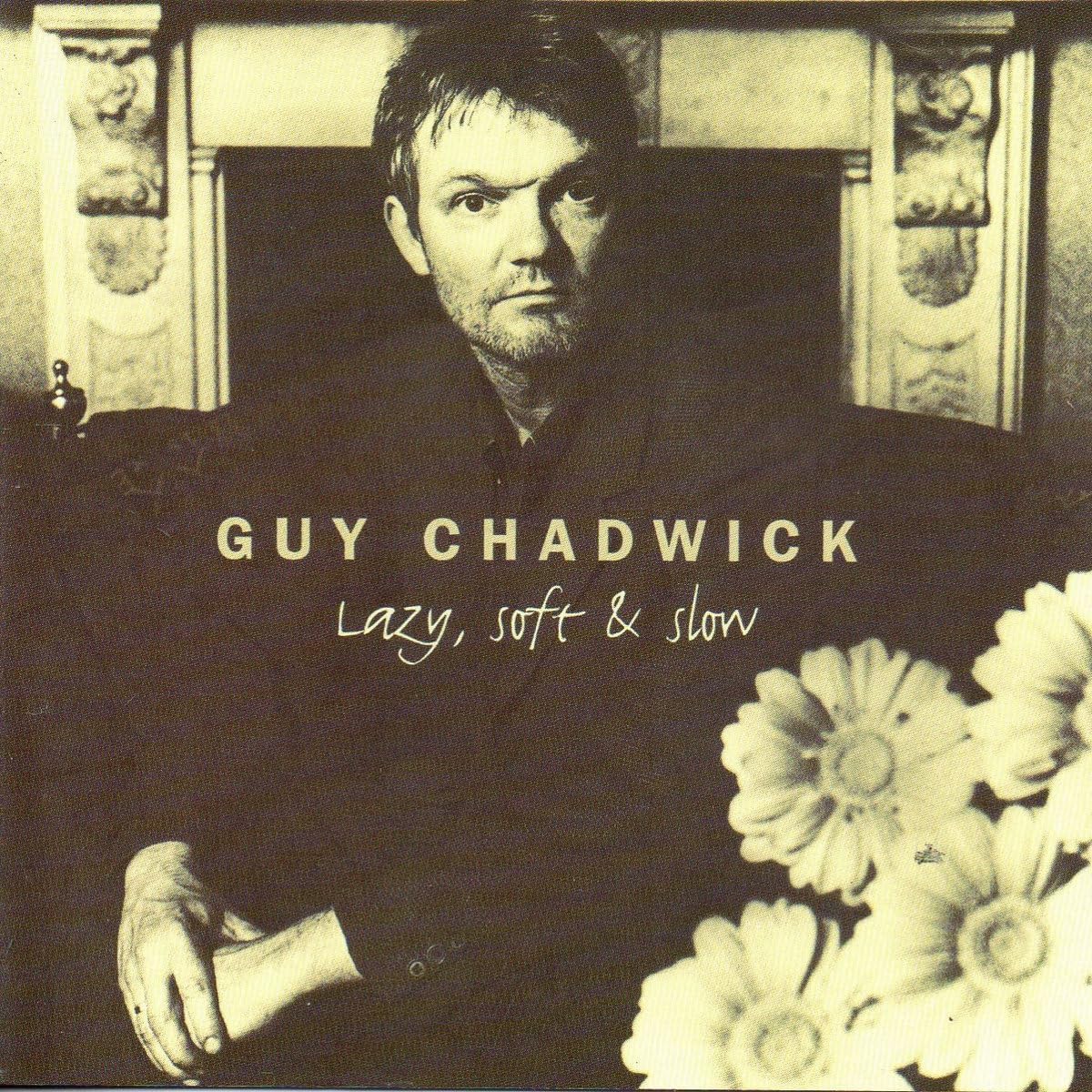 Black and white album cover featuring Guy Chadwick and white flowers.