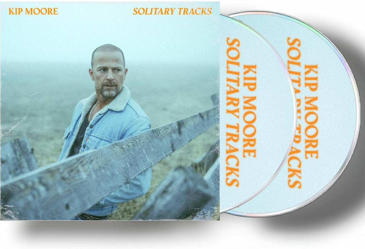 Kip Moore “Solitary Tracks” CD case and two silver compact discs.
