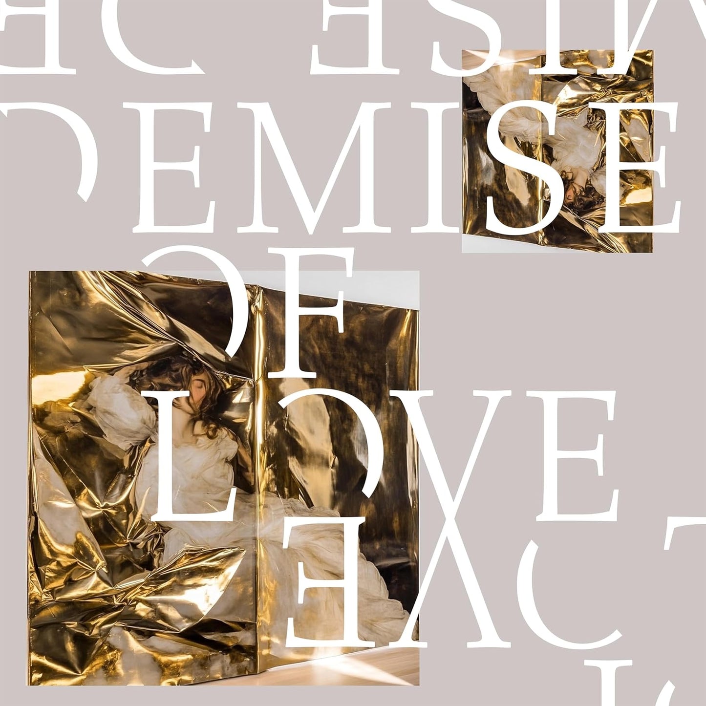 Vinyl record cover with crumpled gold foil and white text.