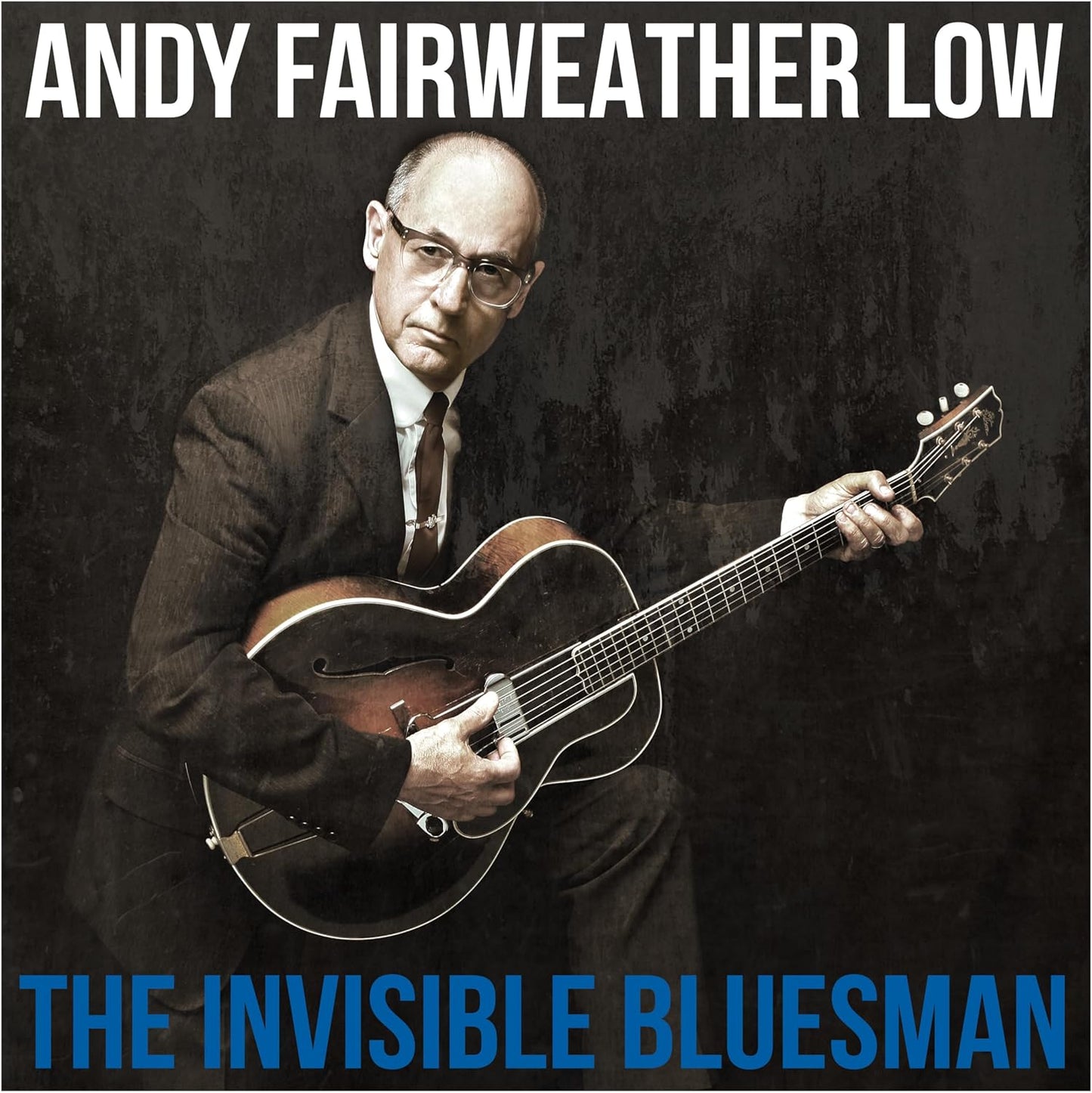 Andy Fairweather Low playing an archtop guitar, album cover art.