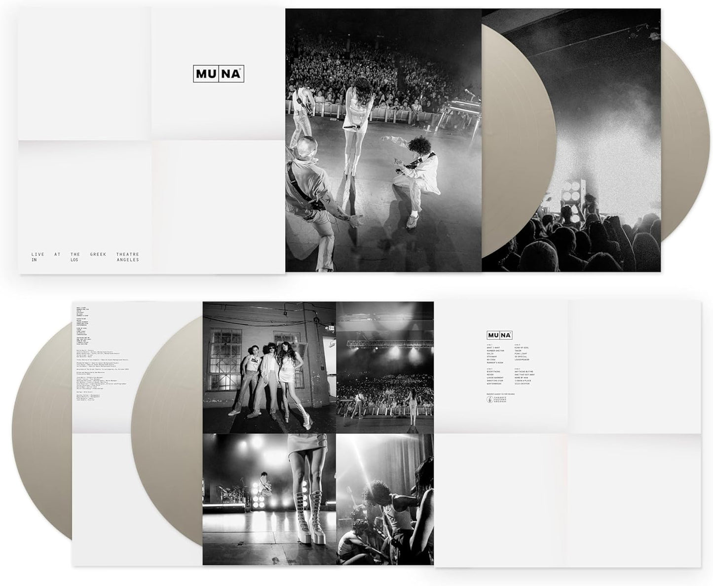 Black and white vinyl records with a band performing live on the cover.