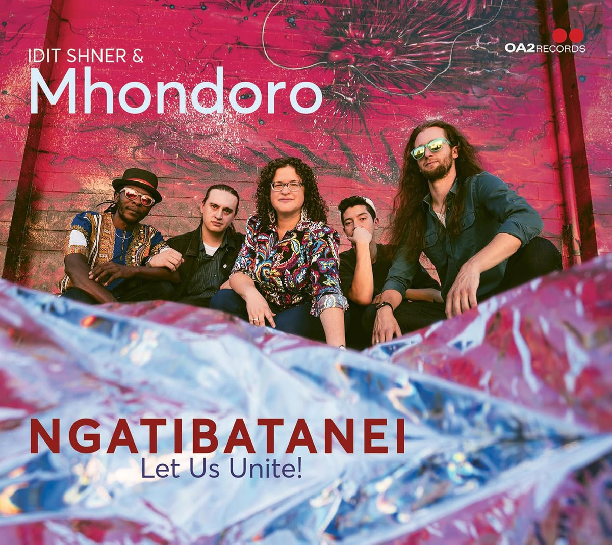CD cover featuring three musicians against a textured, colorful background.