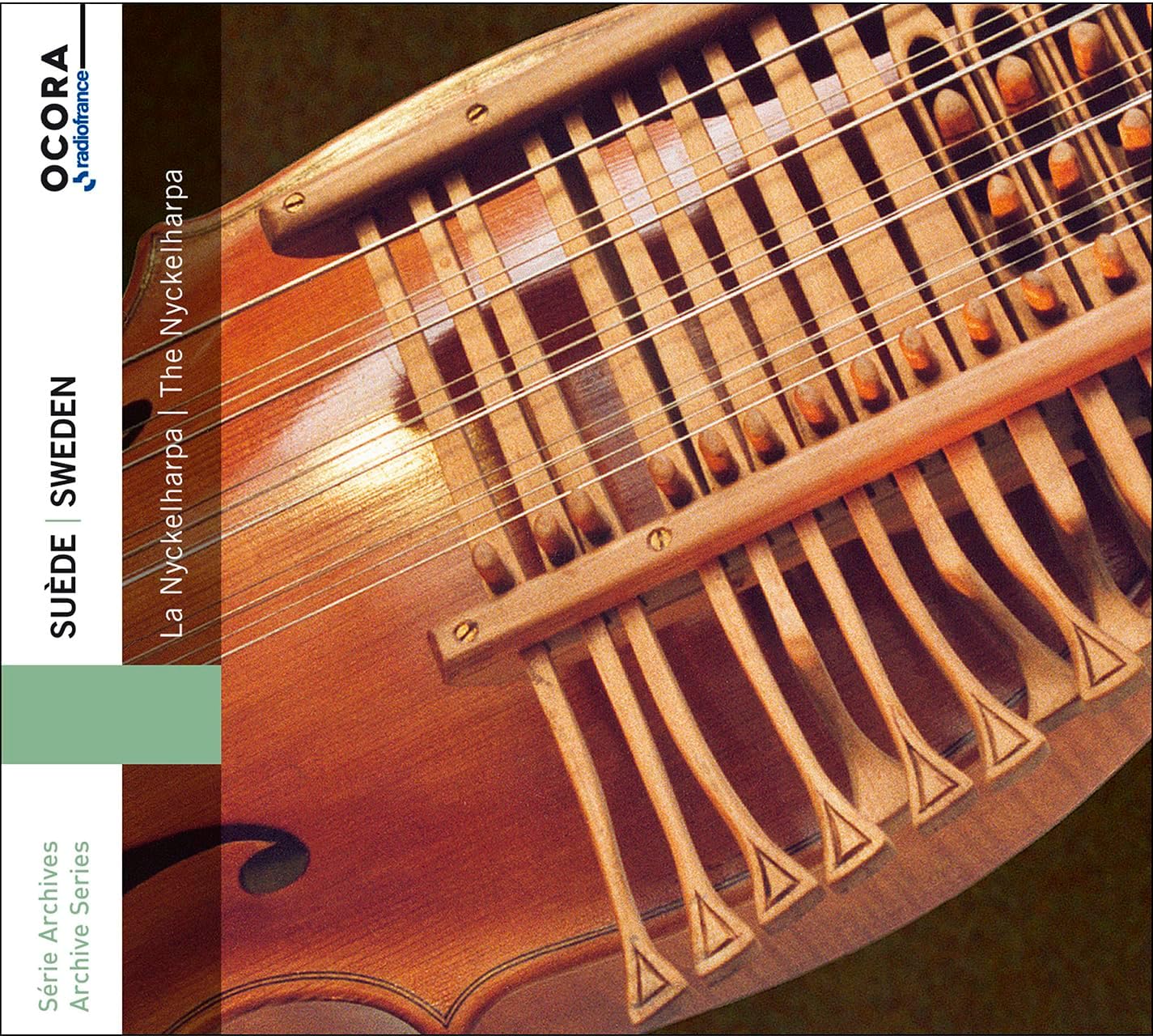 CD cover featuring a close-up of a wooden nyckelharpa, a Swedish keyed fiddle.
