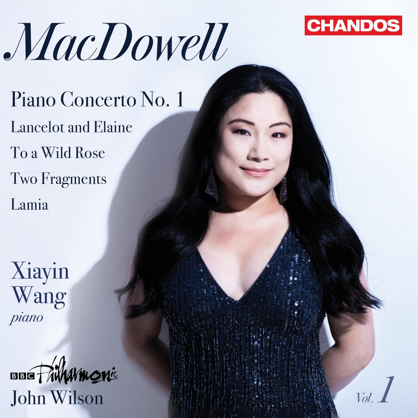 CD cover featuring pianist Xiayin Wang and text listing MacDowell’s orchestral works.