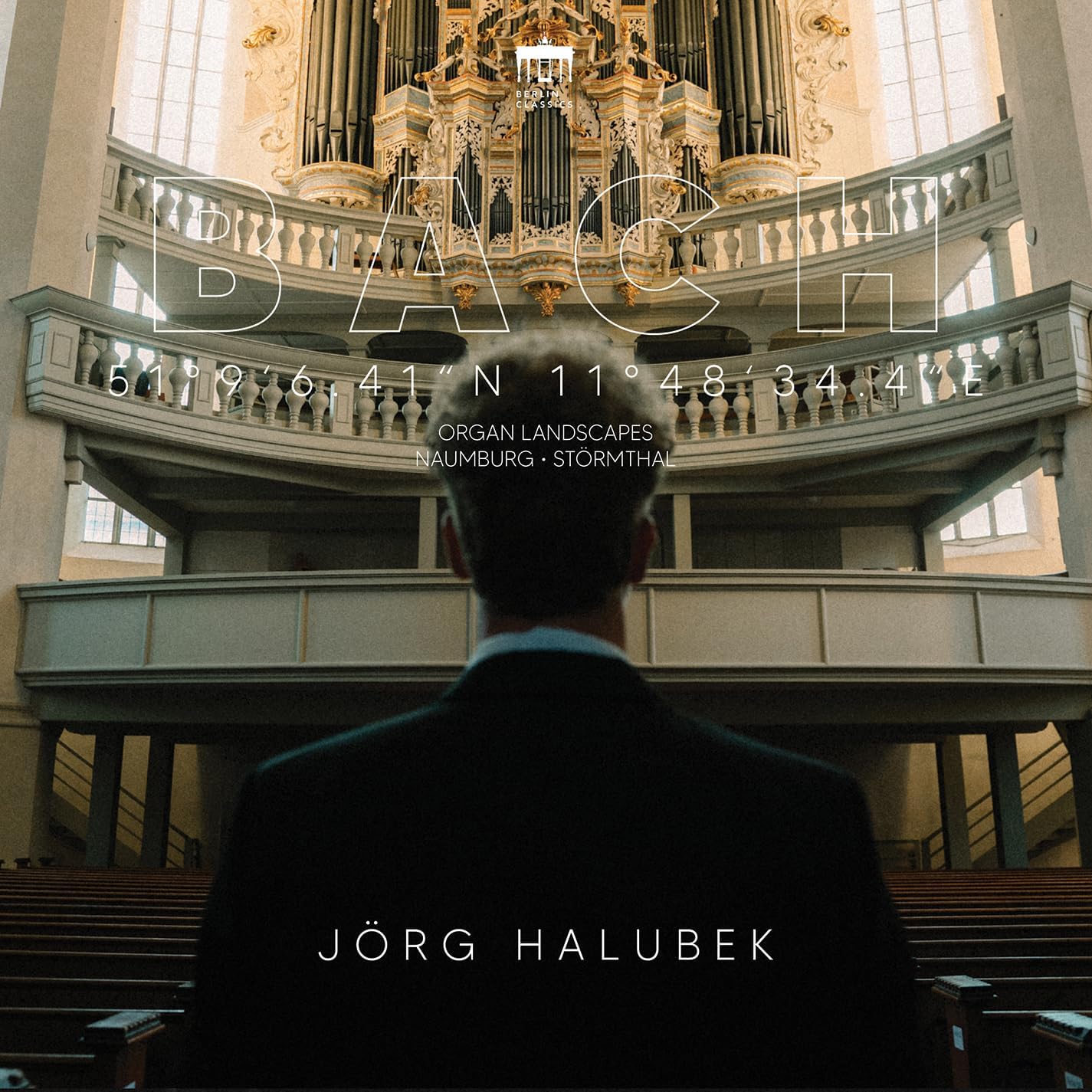CD cover featuring a cathedral organ, coordinates, and a person’s back.