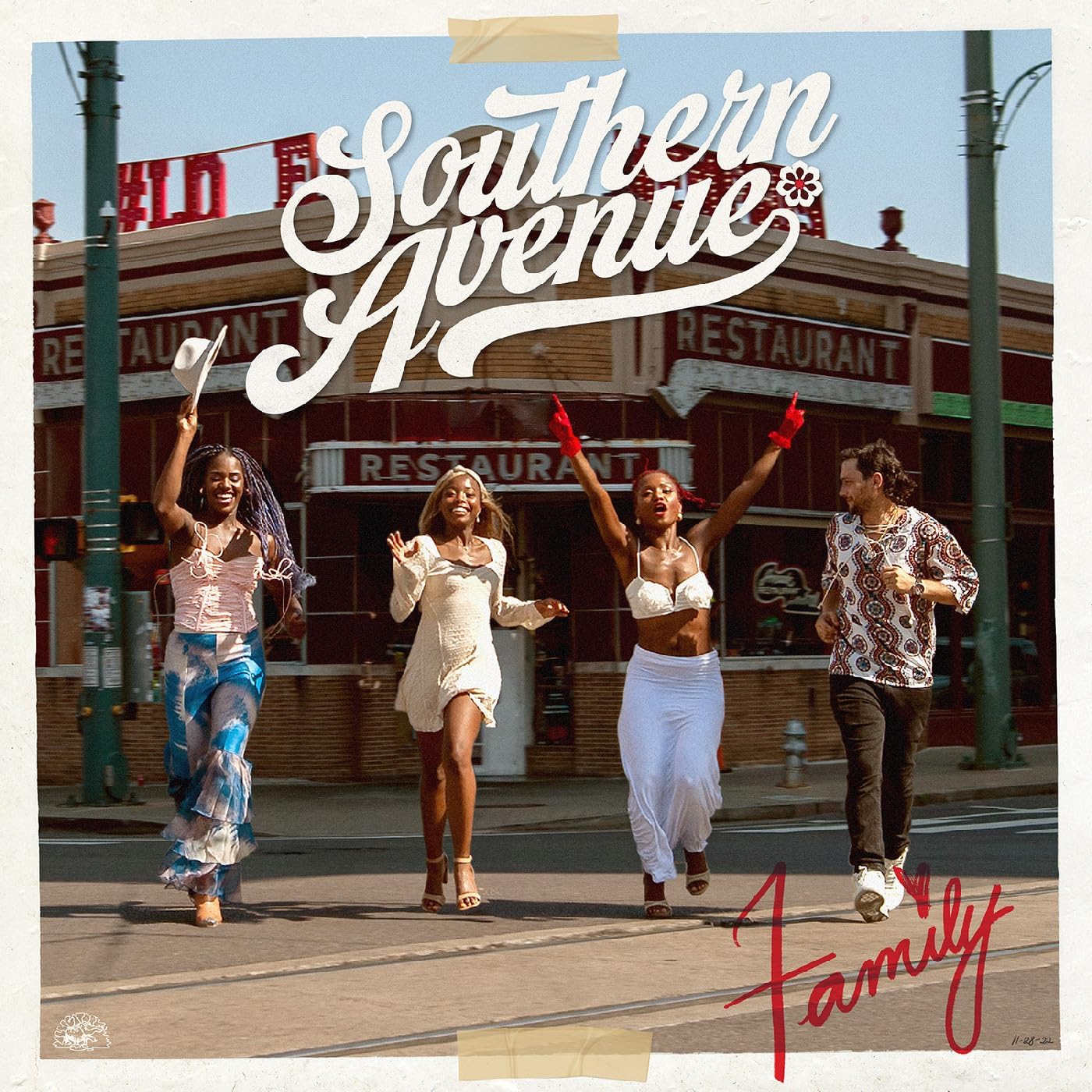 CD cover for “Family” featuring four people on a city street.