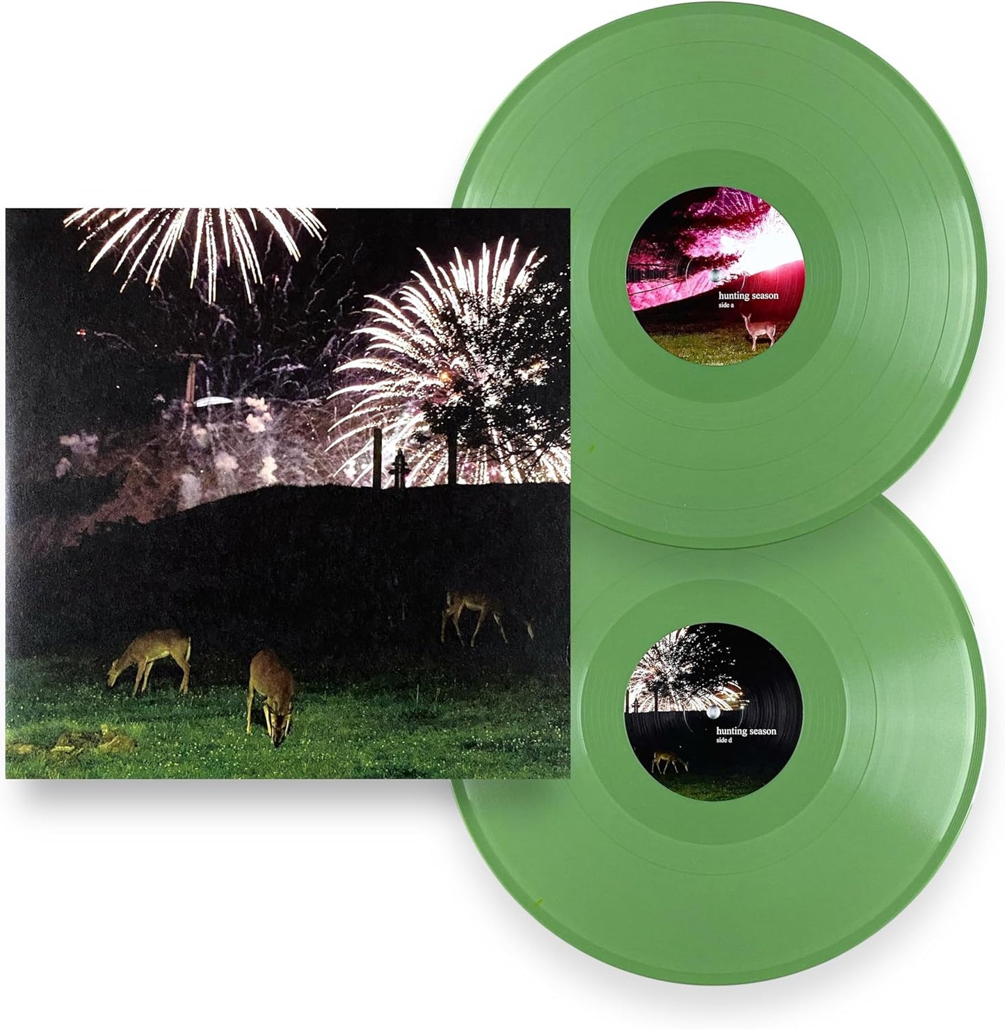 Two green vinyl records with cover art of deer and fireworks.
