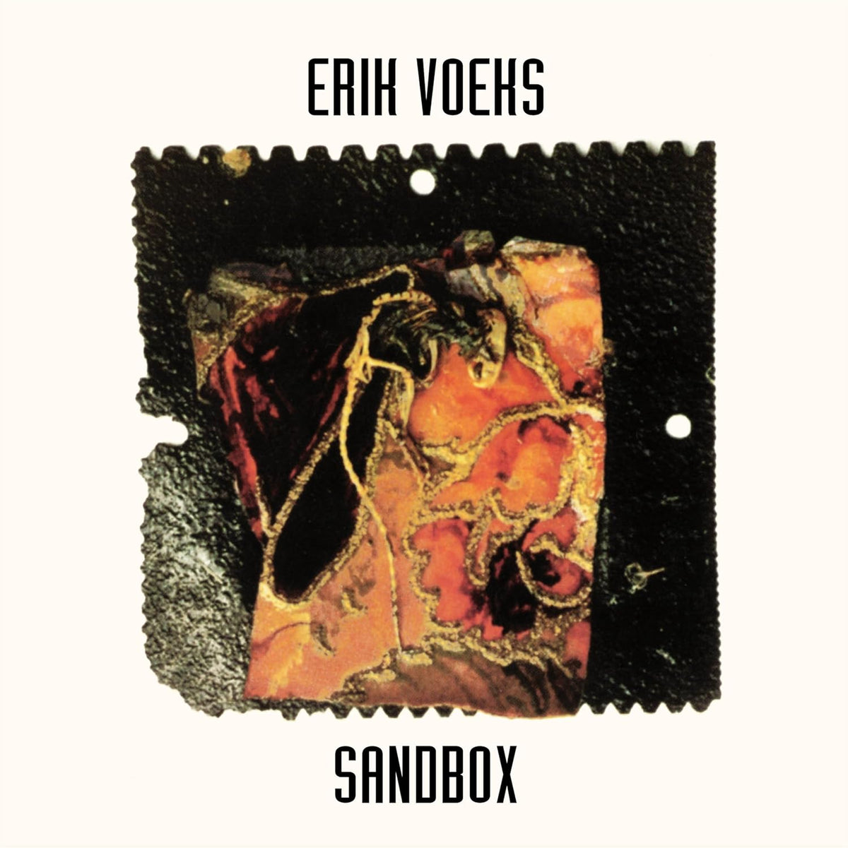 Album cover for Erik Voeks’ “Sandbox” with abstract, textured imagery.