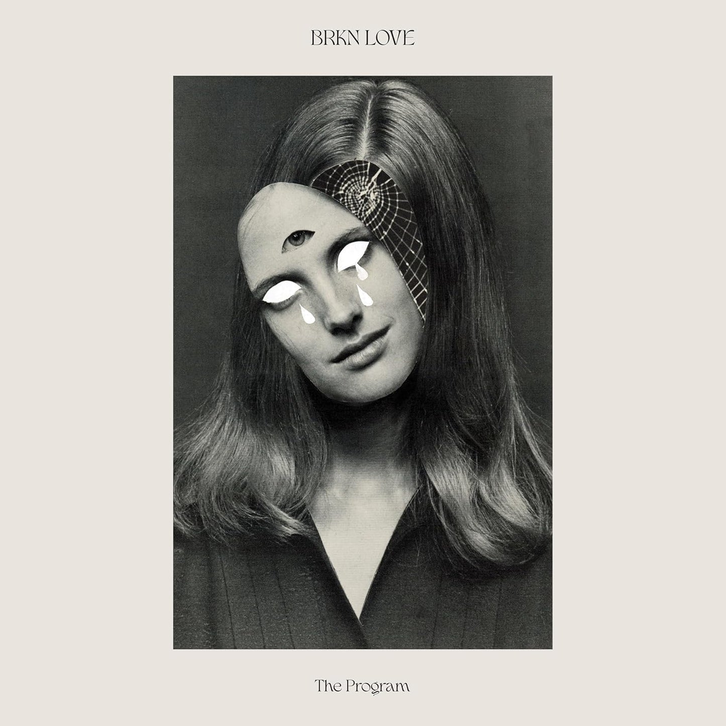 Black and white portrait of a woman with surreal, multiple eyes.