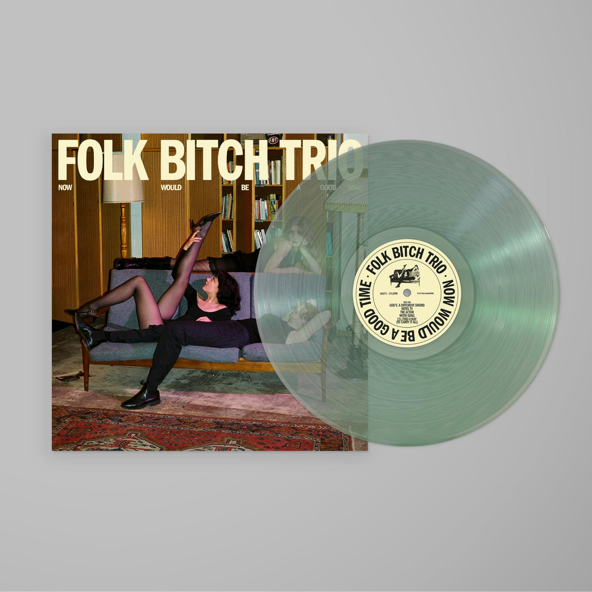 Vinyl record with album art featuring a woman relaxing in a living room.