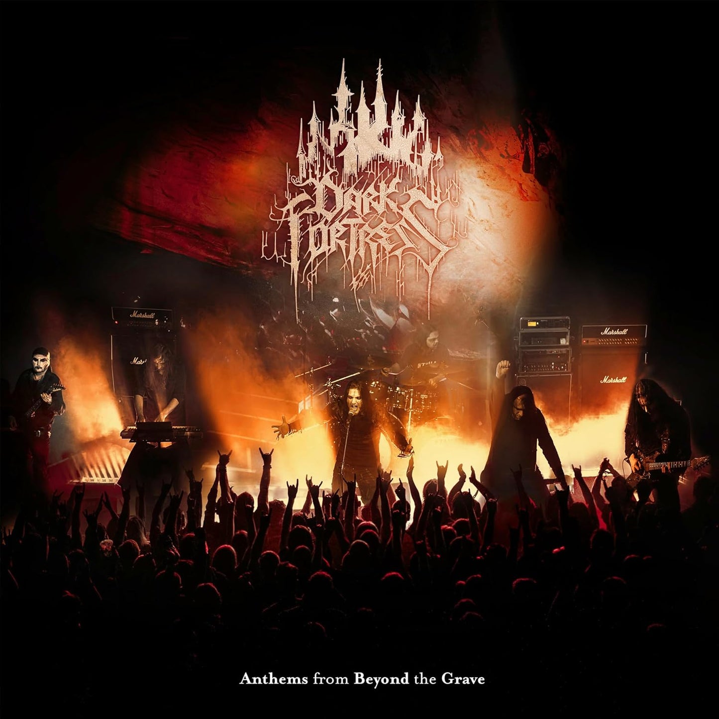 Dark Fortress band performing live on stage with raised hands.
