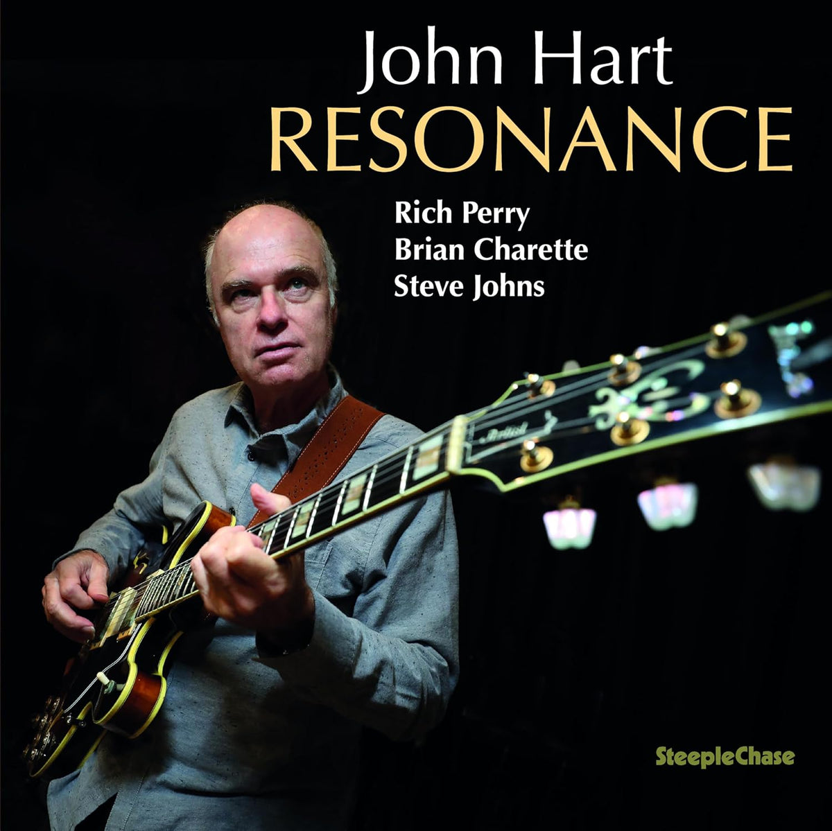 John Hart album cover featuring a guitarist with a gold guitar.
