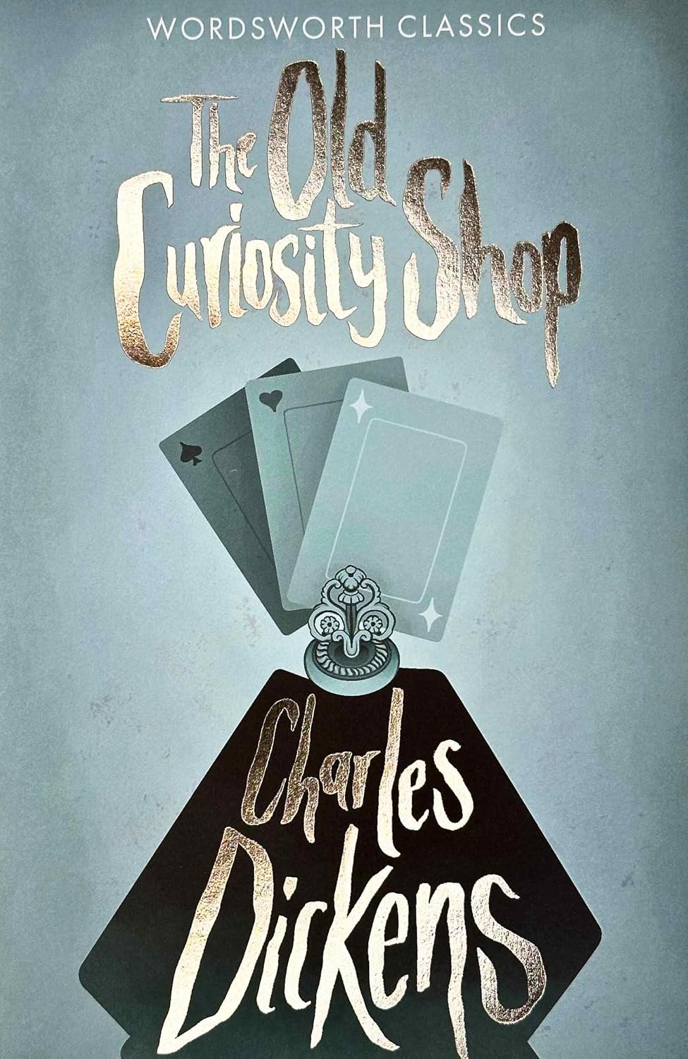 Book cover for The Old Curiosity Shop by Charles Dickens featuring playing cards.