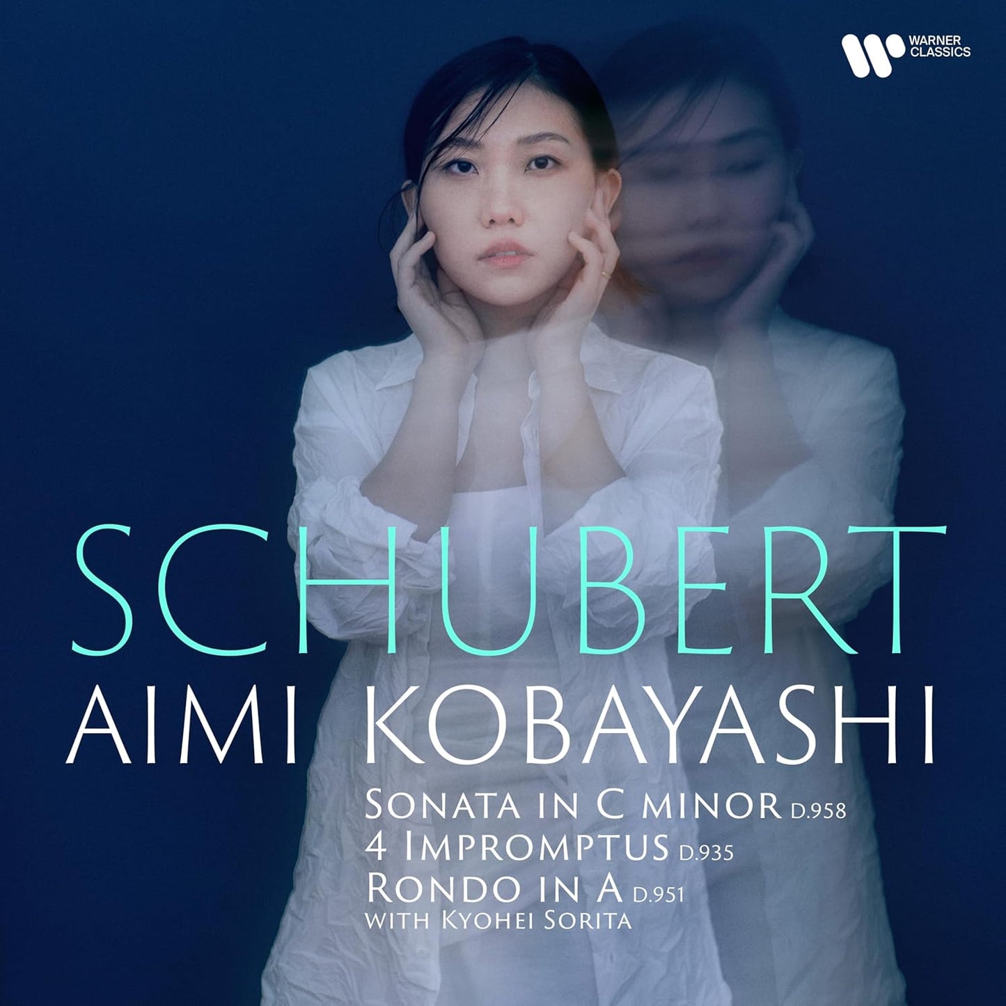 CD cover featuring pianist Aimi Kobayashi in a soft, blurred portrait.