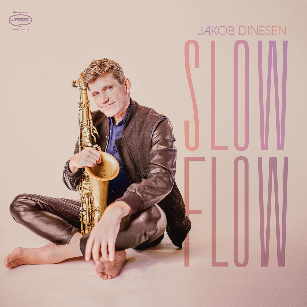 Album cover featuring Jakob Dinesen with saxophone, text “SLOW FLOW”.