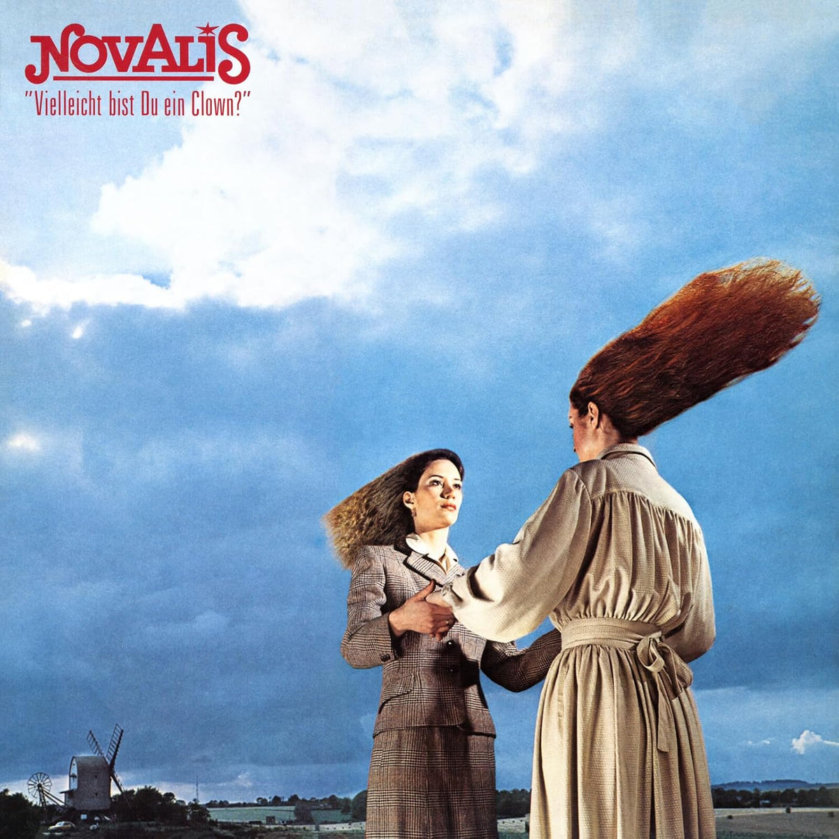 Album cover: two figures with flowing hair embrace in a field.