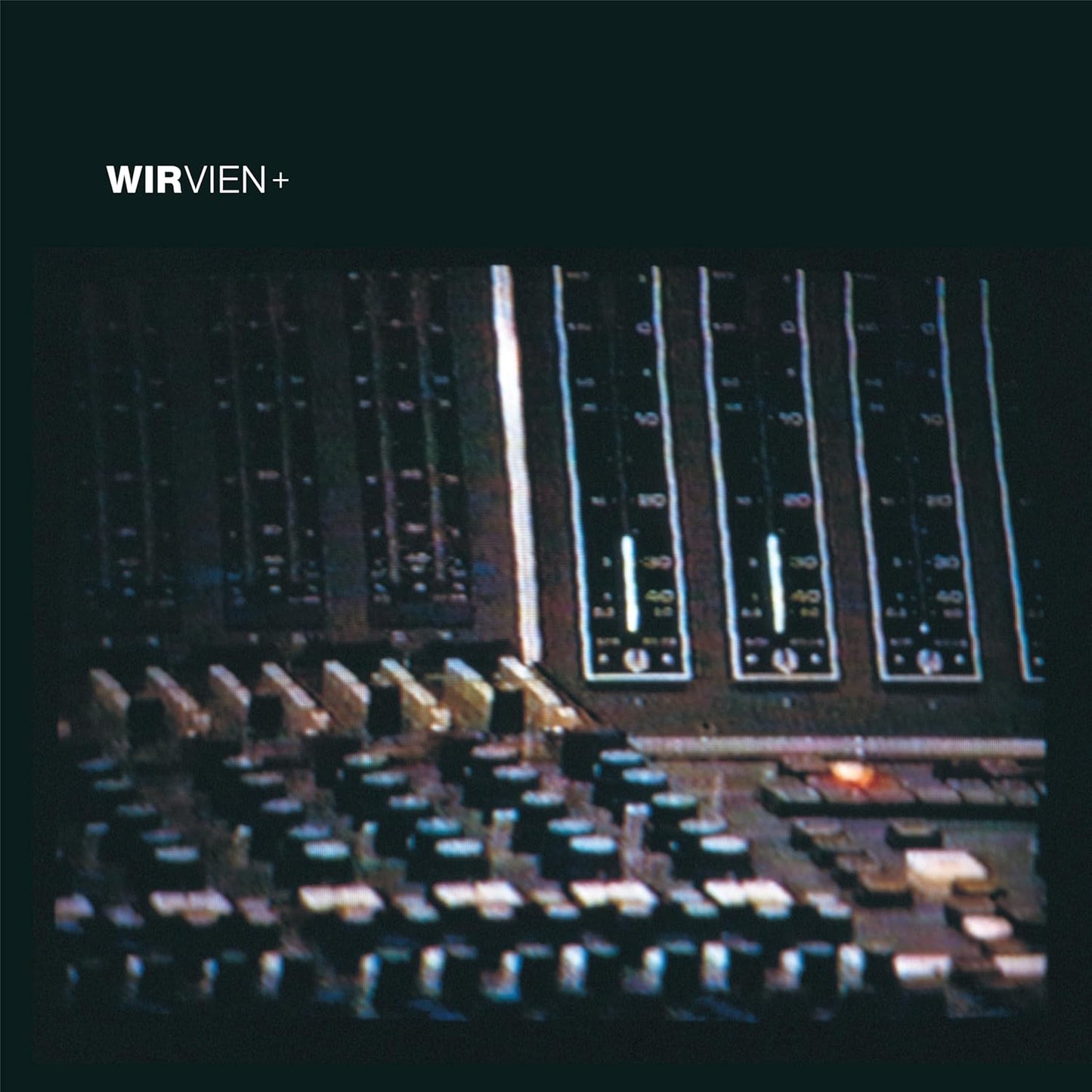 CD cover with a distorted, grainy image of city lights at night.