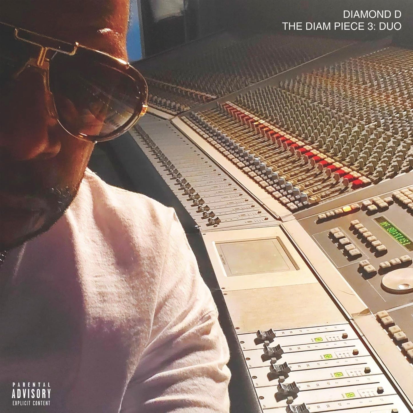 Vinyl album cover featuring a man in front of a mixing console.