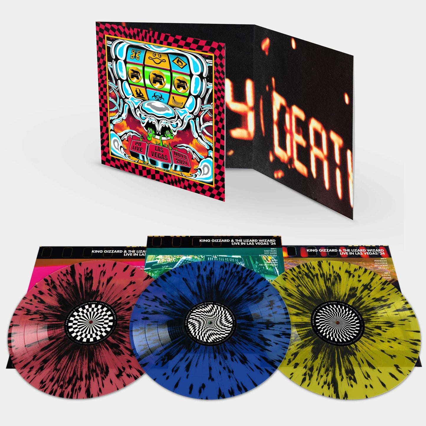 Gatefold vinyl record set with three splatter-patterned discs in red, blue, and yellow.