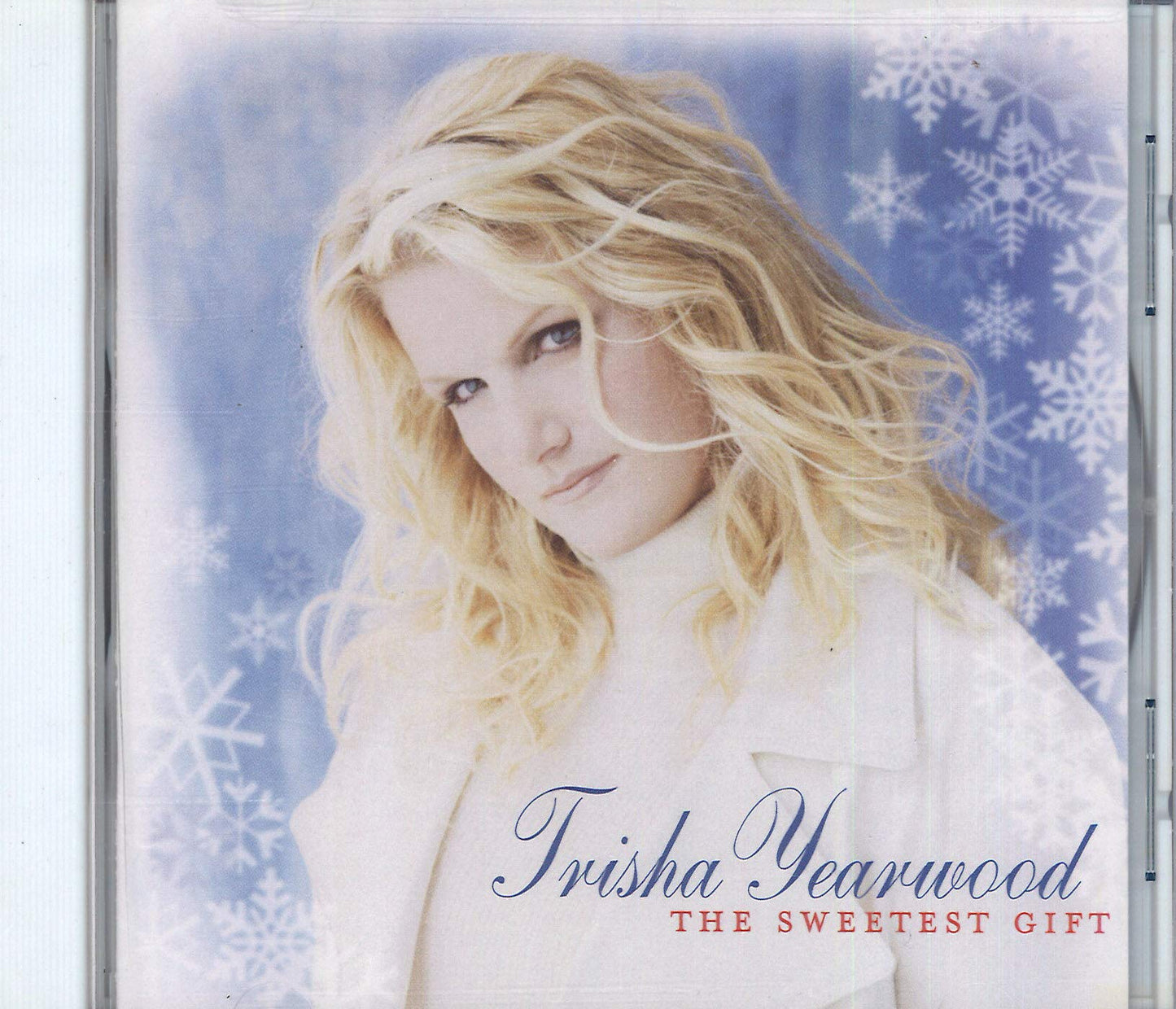 CD cover for Trisha Yearwood's "The Sweetest Gift" with snowflakes.