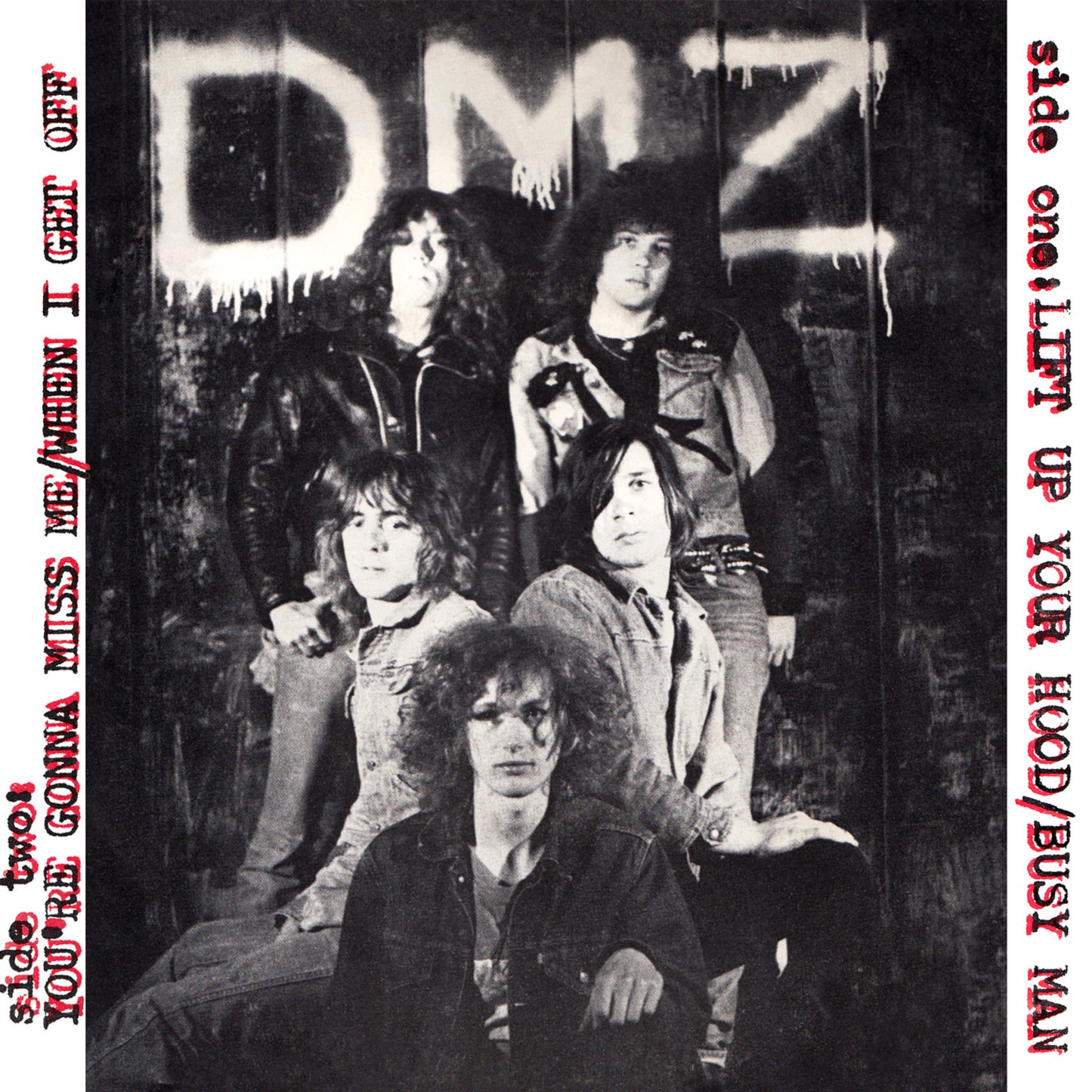 Black and white vinyl record cover featuring a band portrait.