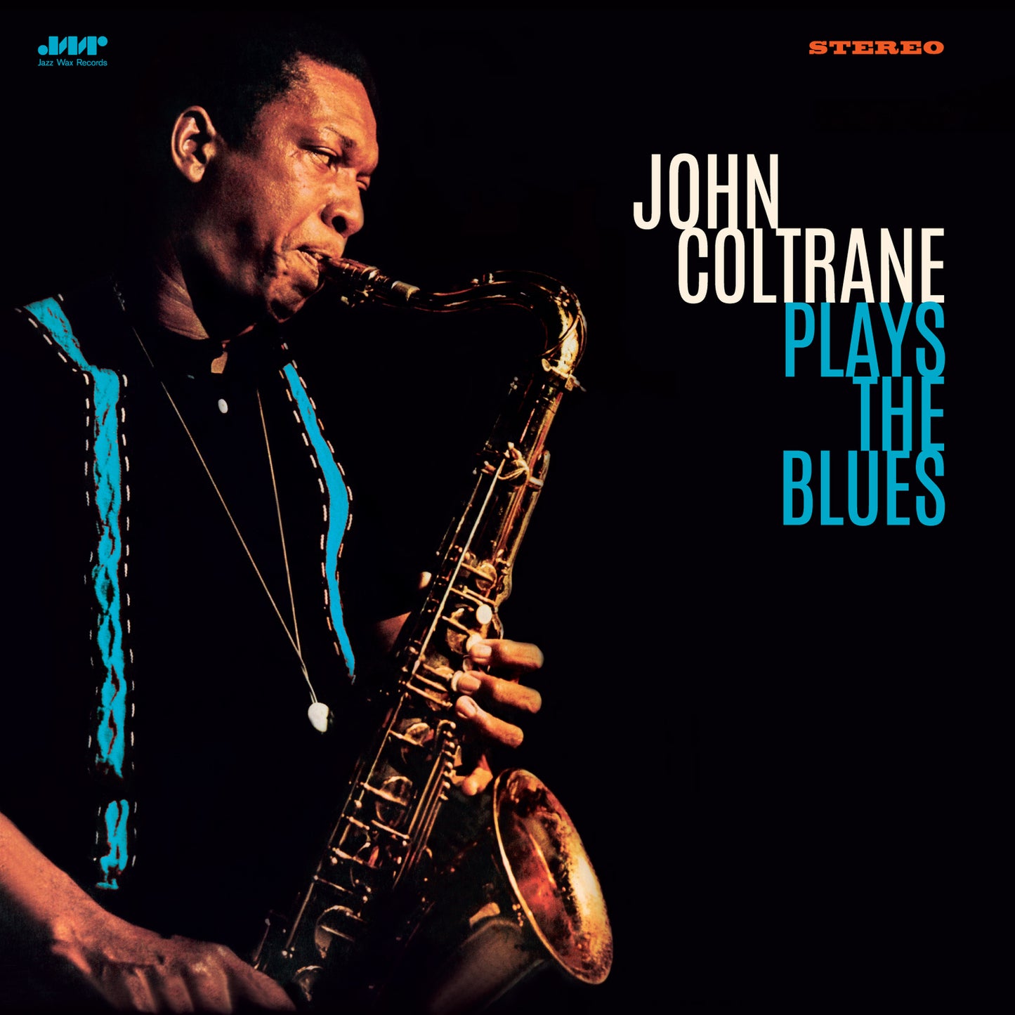 John Coltrane playing a saxophone on the album cover, dark background.