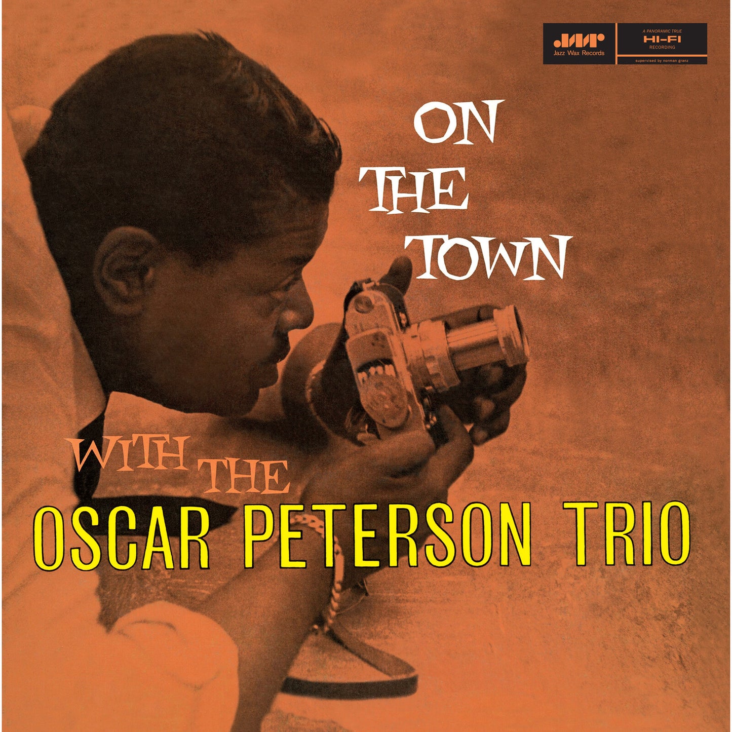 Album cover for Oscar Peterson Trio’s “On The Town” featuring a pianist.