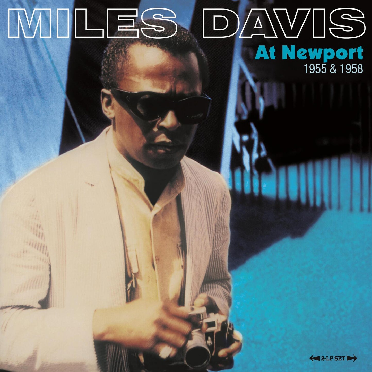 Miles Davis album cover, “At Newport 1955 & 1958”, featuring a portrait.