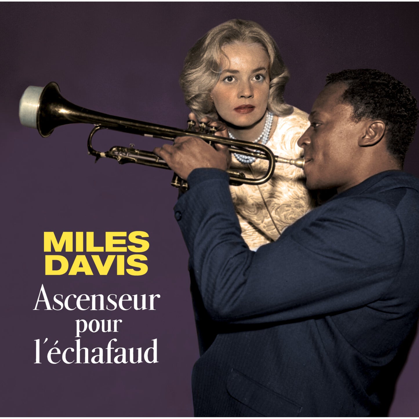 Miles Davis playing trumpet with a woman’s face in the background.