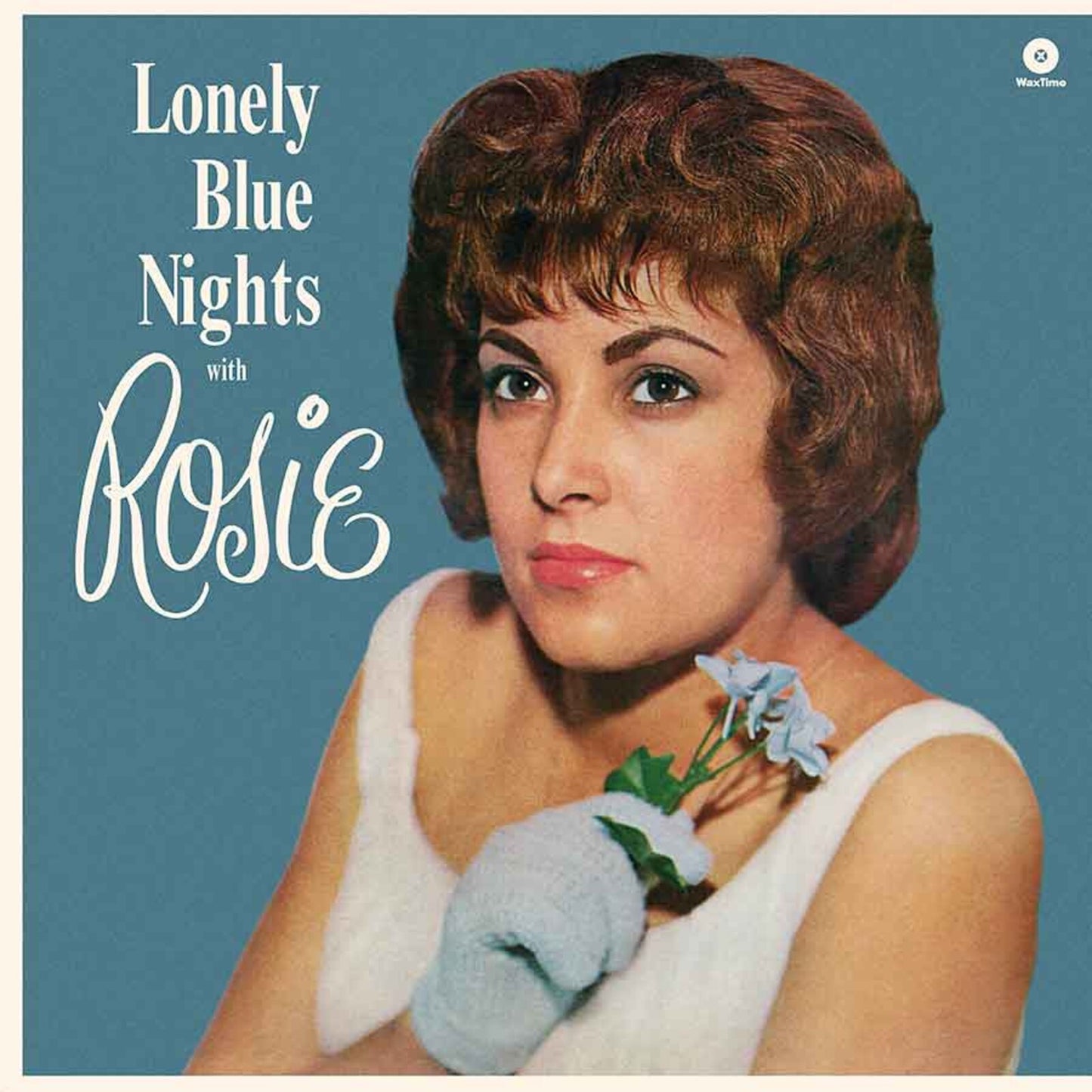 Album cover featuring a woman in a white top holding blue flowers.