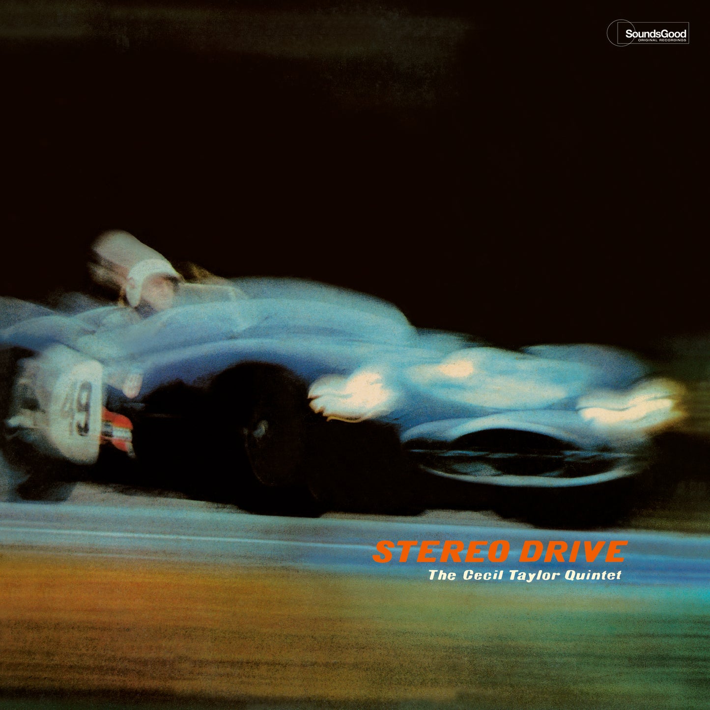 Record album cover featuring a blurred image of a vintage race car.