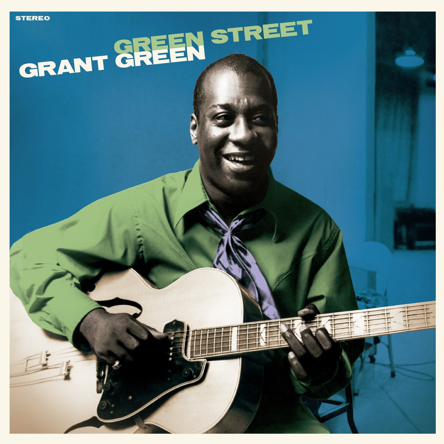 Grant Green album cover: portrait of a smiling guitarist with a guitar.
