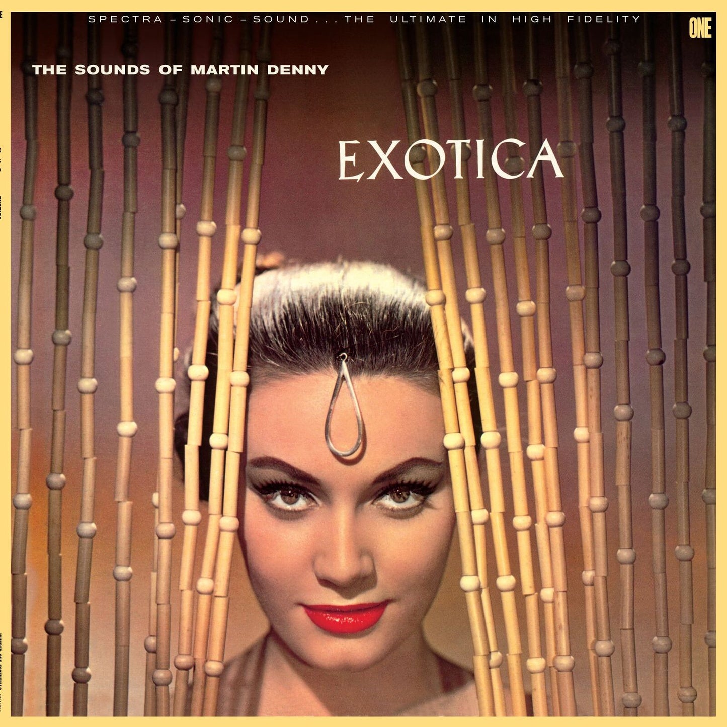 Woman with a forehead ornament peeking through bamboo bead curtains on album cover.