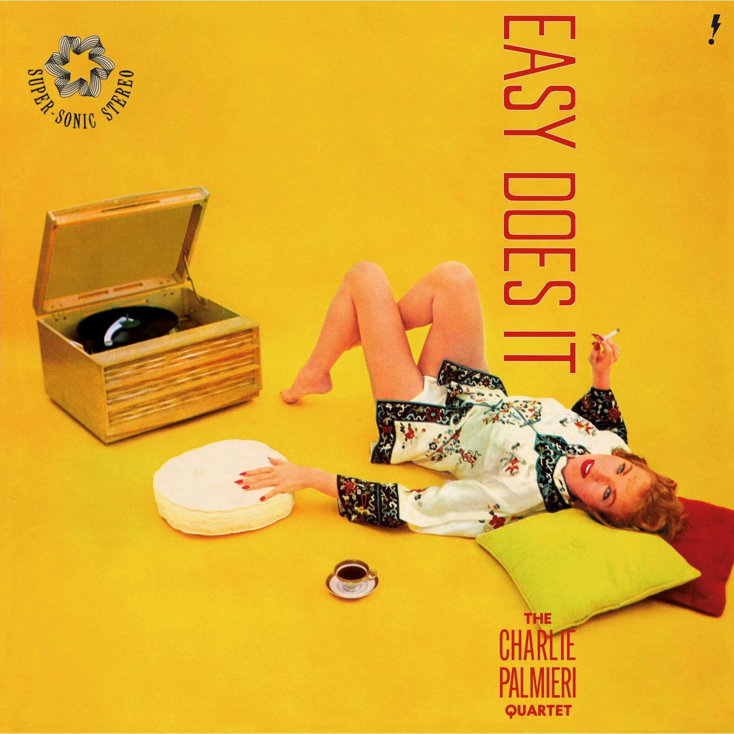 Yellow vinyl record cover with a woman lounging near a record player.