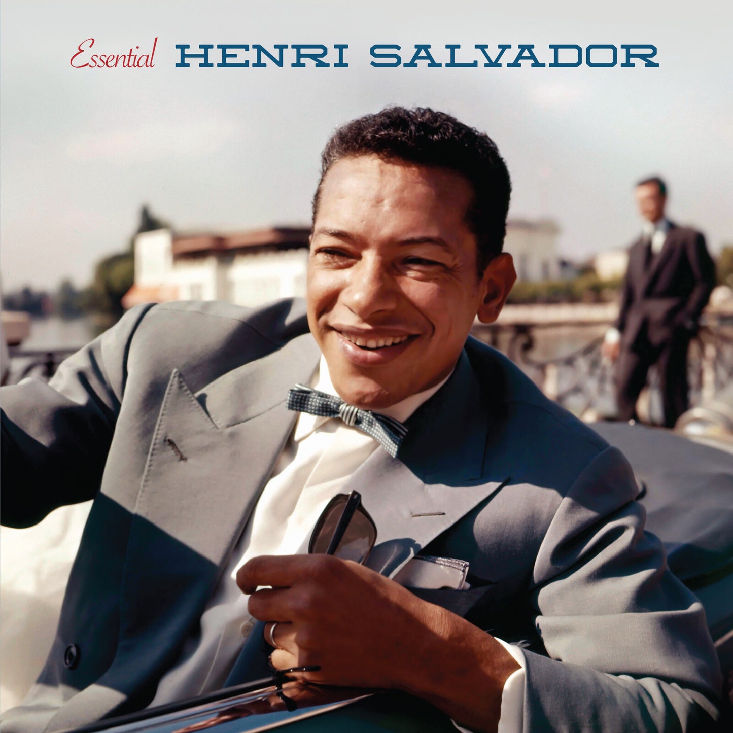 Henri Salvador album cover featuring a smiling man in a suit.