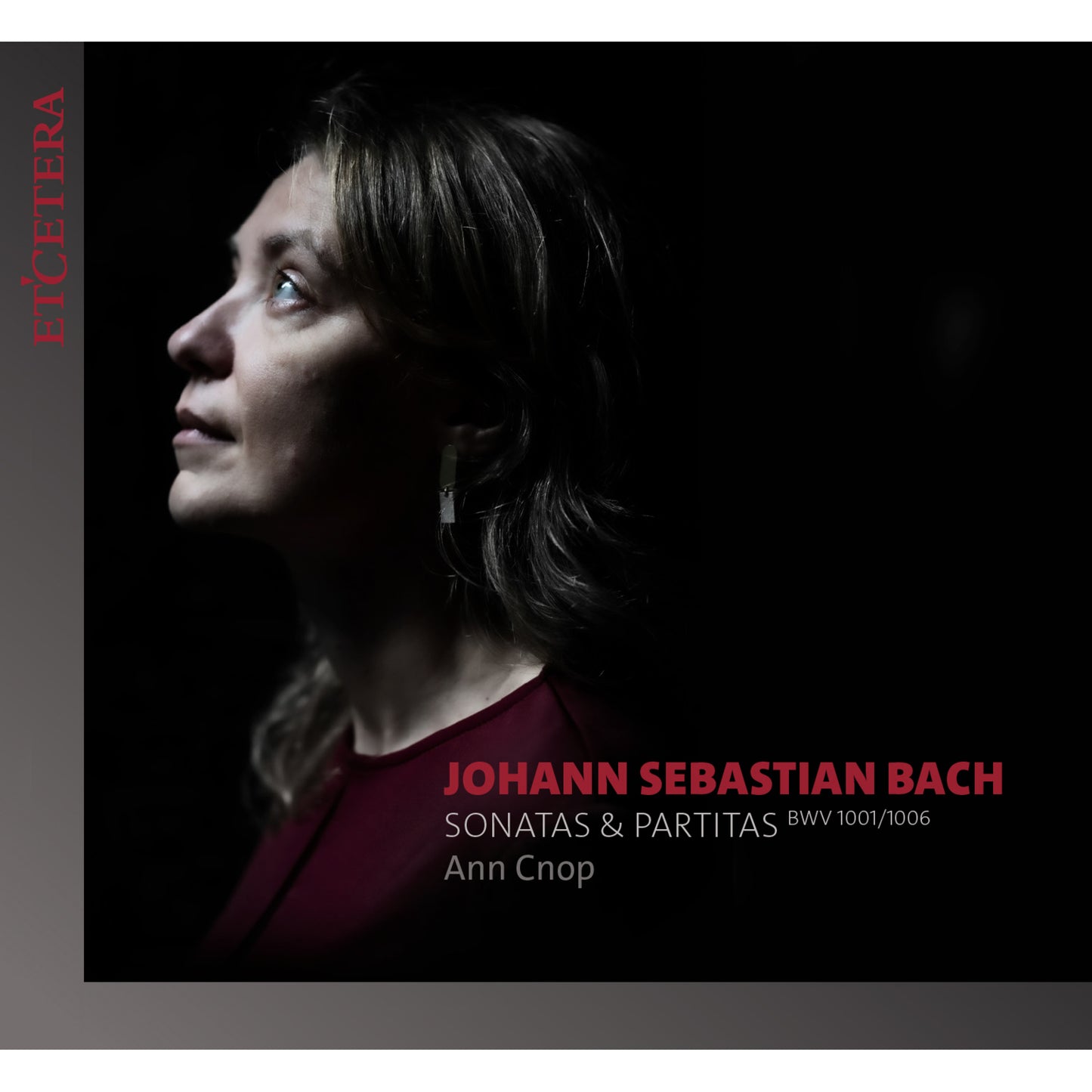 CD cover: Ann Cnop, portrait against a dark red background.