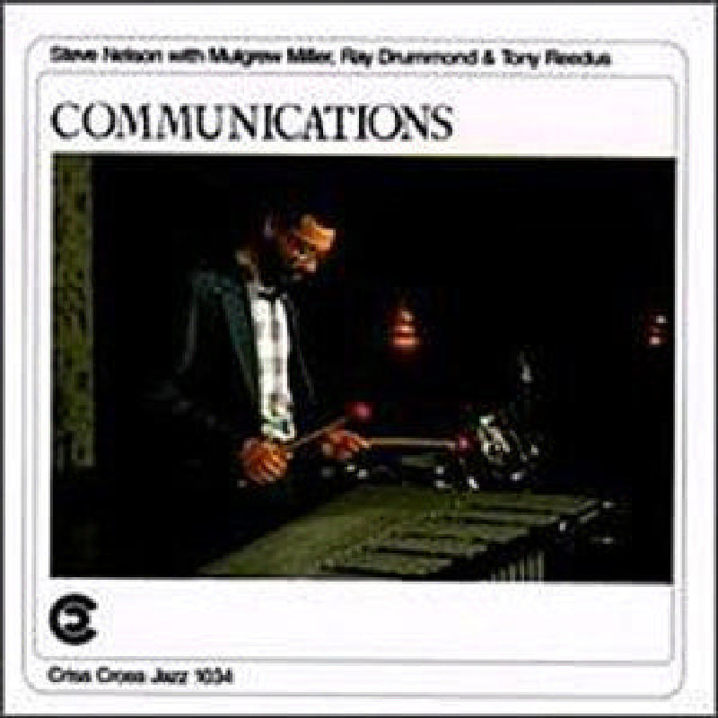 CD cover: Steve Nelson playing vibraphone, dark studio setting.