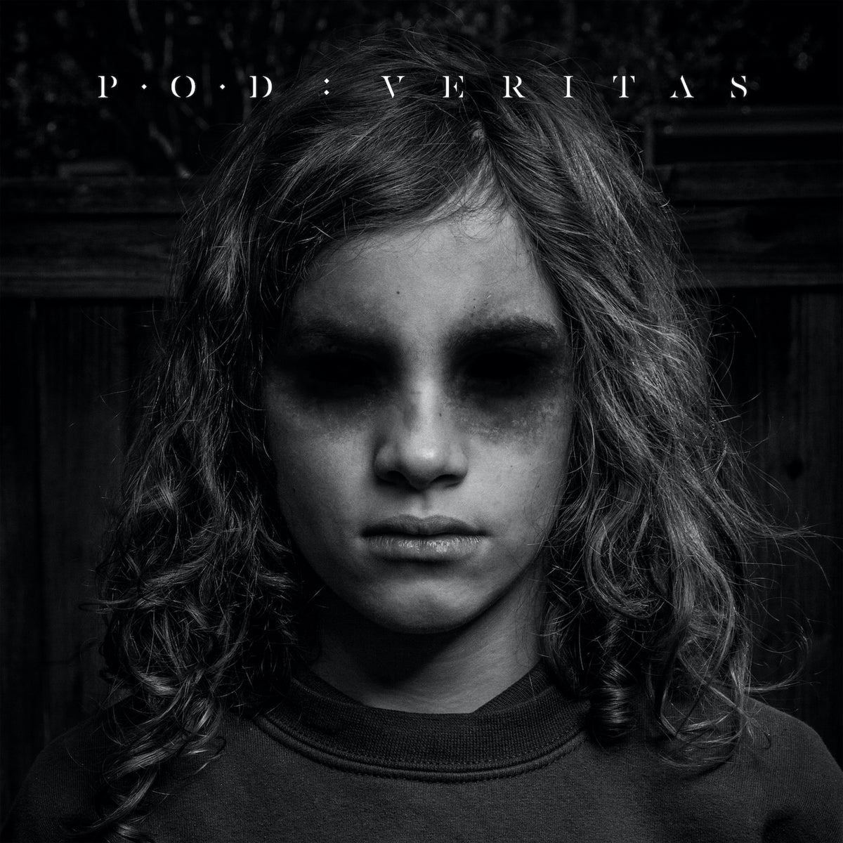 Black and white album cover featuring a young person with dark eyes.